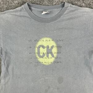 Calvin Klein Jeans T-Shirt Womens Size L Blue Graphic Logo Distressed Faded Tee